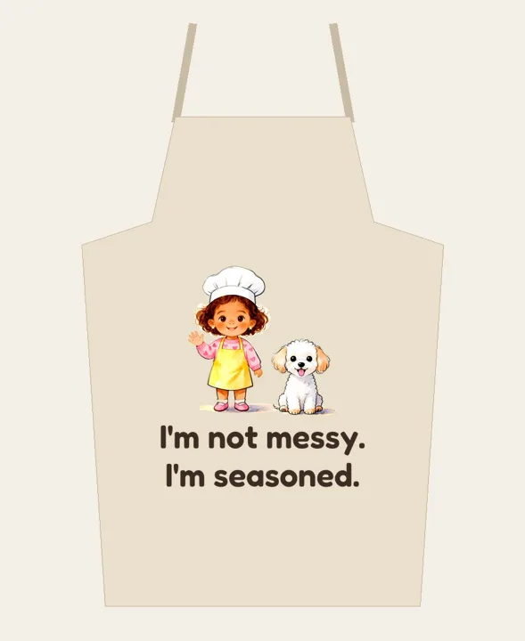 Apron that says "I'm not messy. I'm seasoned." with Chef May and Coco